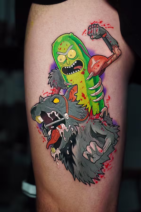 Colorful tattoo on a leg depicting Pickle Rick from Rick and Morty riding a snarling rat, with blood splatter details and vibrant green, gray and red colors