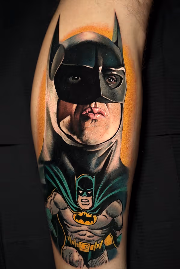 Tattoo on a leg featuring a realistic portrait of Batman above a classic comic-style Batman with cape and emblem.