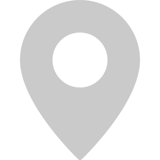 Gray map location pin icon with a circular cutout in the center.